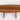 Wooden oval table on a white background