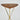 Wooden table with gold metal legs on a light gray background