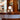 Wooden bar counter with decorative tile edge and smoke glass gelato lamp carlo nason