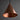Copper pendant light against a dark background