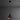 Black pendant light with copper interior on a dark gray background