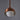 Copper pendant light with a white bulb on a gray background for Two Enlighten