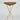 Wooden table with gold metal legs on a white background