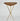 Wooden table with gold metal legs on a white background