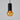 Pendant light with black cylindrical fixture and amber glass bulb on a gray background