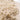 Close-up of a beige shaggy rug with a soft texture.