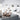 string-system-livingroom-white shelving jeanneret chairs two enlighten.jpg