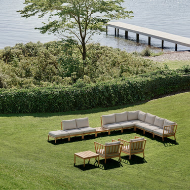 Tradition Collection for Fritz Hansen outdoor seating configuration by a lake.jpg