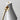 White lampshade with gold stand on a light gray background