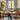 midcentury Tratten conical pendant over a dining table 