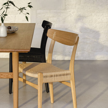 Ch23 chair in oak oil and stained black oak wegner chairs in dining room