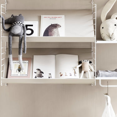 String system magazine shelf 58 x 30 beige children's room book display.jpg