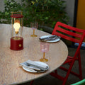 the_muse_in_pomona_red_on_table_garden_setting_close_up_lifestyle_2048x2048_f98a3f22-afa3-