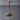Brass farmhouse style pendant lamp on a grey background