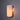Wall-mounted light fixture with a cylindrical lucite shade on a dark background