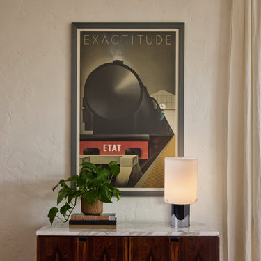 vintage perspex and chrome cylindrical table lamp on credenza with Etat 1930s vintage french poster