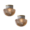 Two vintage ceiling lights with ribbed glass shades on a white background
