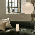 tom dixon frosted press pendant in green and beige living room