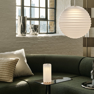tom dixon frosted press pendant in green and beige living room