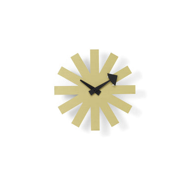 Modern wall clock with gold sunburst design on a white background