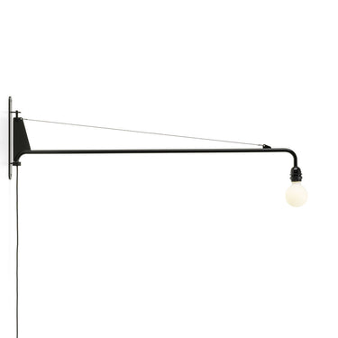 Black wall-mounted lamp with a white bulb on a white background