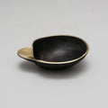 aubock brass dish on grey background