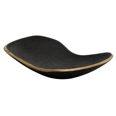 Black wavy catchall dish on a white background