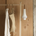 Nendo Tomoshi portable lamp poulsen hanging on a rack