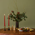 candleholder and holiday decro on a wood sfax chapo table
