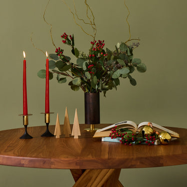 candleholder and holiday decro on a wood sfax chapo table