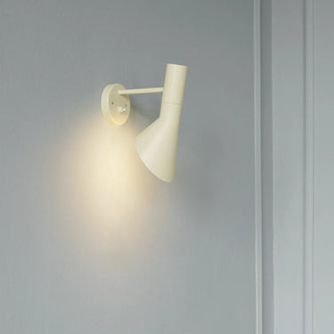 AJ Wall soft lemon lit lifestylel Arne Jacobsen for Louis Poulsen.jpg