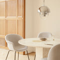 Travertine Dining Table by GamFratesi for GUBI GUBI Home_Moments_1pm_V2.jpg