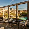 Mategot Tropique Dining Table for Gubi GUBI_MILAN_23_0076_TENTS AND TERRACE.jpg