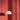 White AJ Royal pendant light against a red textured wall