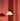 White AJ Royal pendant light against a red textured wall