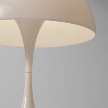 White mushroom-shaped lamp on a gray background