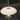 A modern table lamp with a wide, shallow dome-shaped white glass shade and a slim white stem, shown against a dark, blurred background.