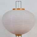 Spherical akari 10A lamp with ribbed design on a white background