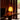 Akari 1A lamp on a wooden table with a dark curtain background at schaffer lautner house whiting woods