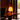 Akari 1A lamp on a wooden table with a dark curtain background at schaffer lautner house whiting woods