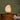Akari 1N washi paper Table lamp on a wooden surface with candles and books against a green wall