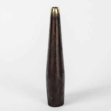 Tapered brass vase on a white background