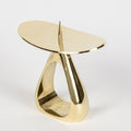 brass midcentury candleholder on a white background