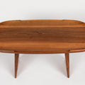Wooden oval table on a white background