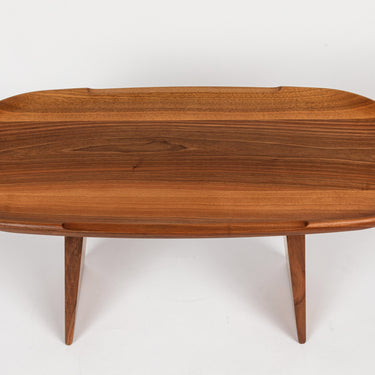 Wooden oval table on a white background