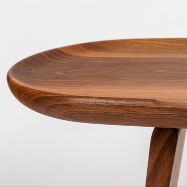walnut side low table with a smooth surface on a white background