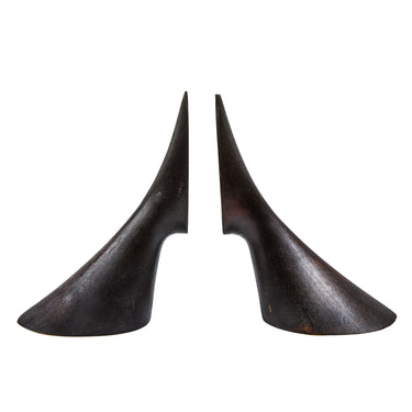 Pair of dark brass bookends on a white background