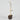 Decorative vase with a brown base and gold metal stand on a light gray background