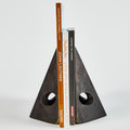 Triangular bookend holding books on a white background