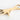 Gold hand-shaped bottle opener on a white background